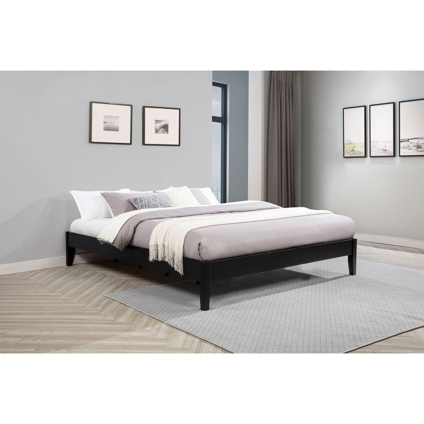 Hounslow platform bed by HouseOfZazla in black wood with white-gray bedding and cream throw on Tampa Home & Garden Store