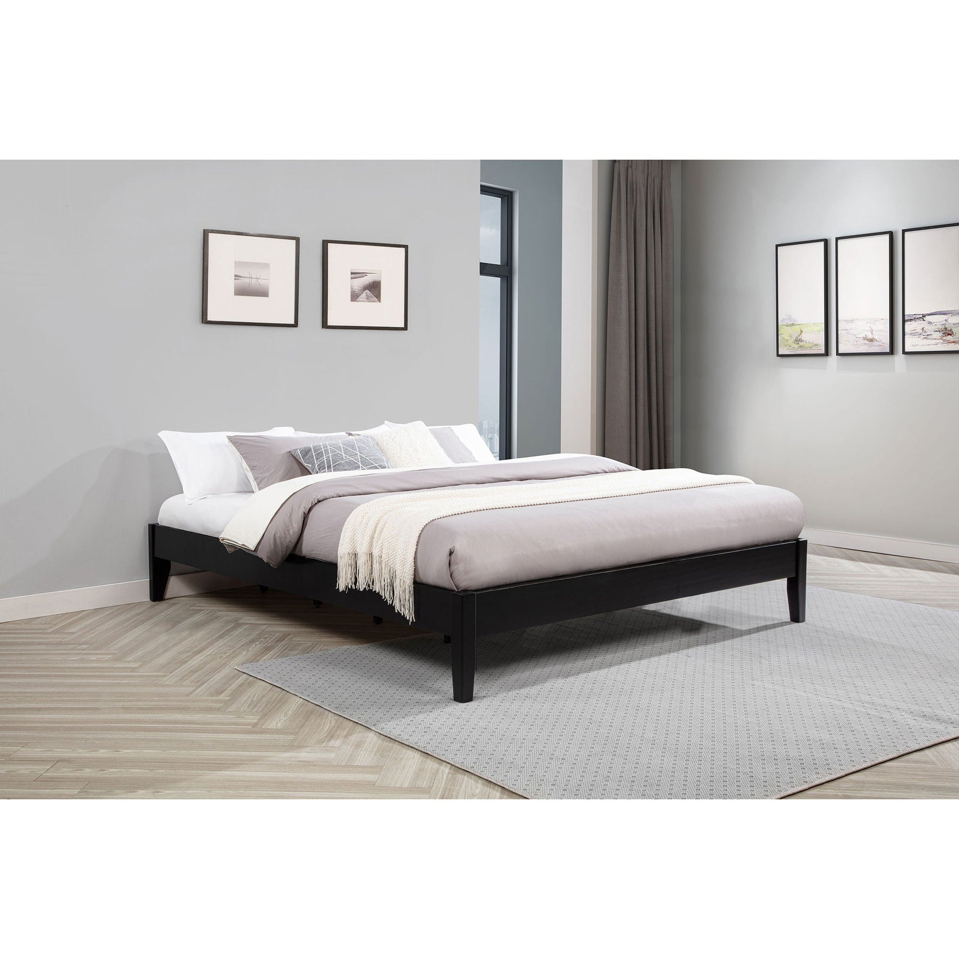 Hounslow platform bed by HouseOfZazla in black wood with white-gray bedding and cream throw on Tampa Home & Garden Store