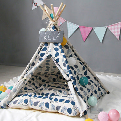 Pet tent teepee with blue leaf print fabric, wooden poles, and a KELA sign for dogs or cats on Tampa Home & Garden Store
