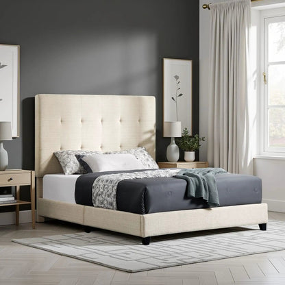 Tufted upholstered platform bed in beige fabric against a dark gray wall with neutral bedding on Tampa Home & Garden Store