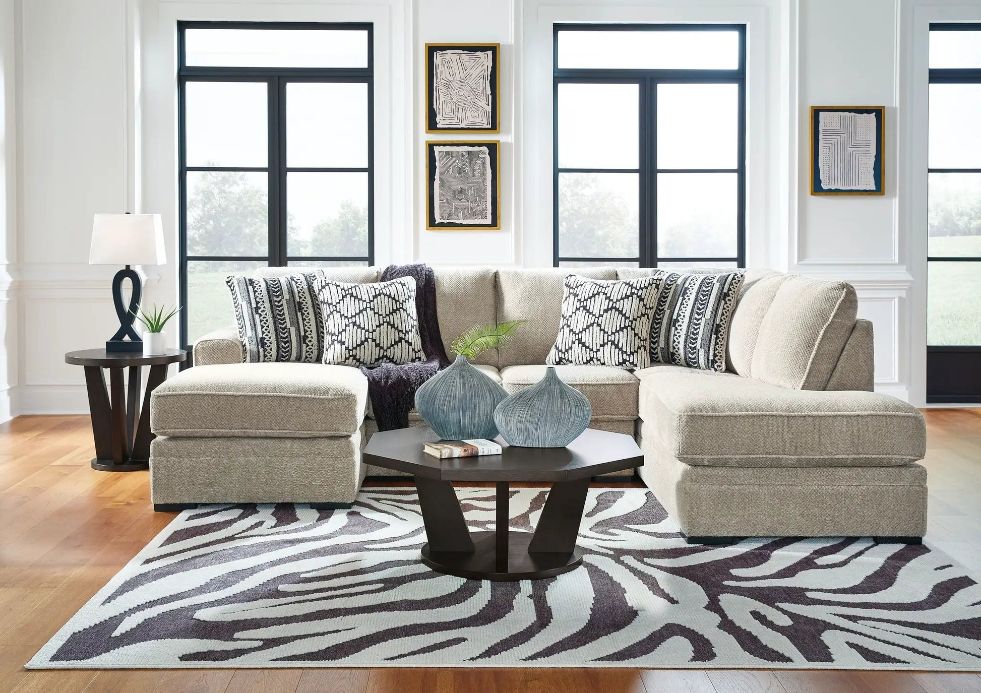 Calnita Sectional beige sofa with black-and-white cushions by Unique Piece Furniture on Tampa Home & Garden Store