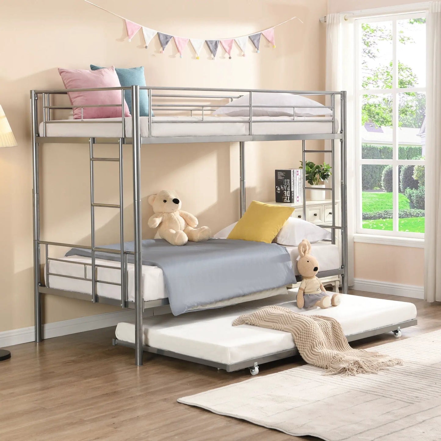Bunk Bed With Trundle in silver metal frame; dual bunks, pink and blue pillows, two teddy bears on Tampa Home & Garden Store