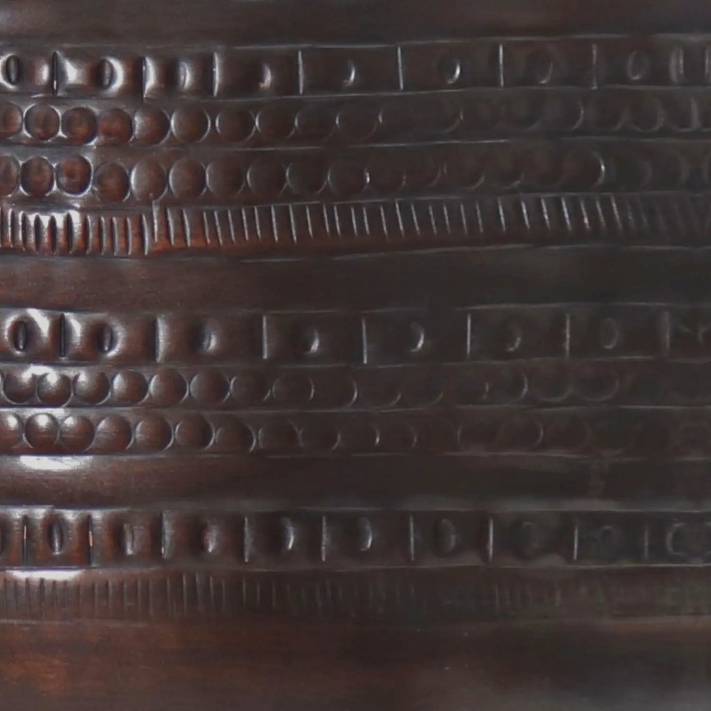 Johnsen Handcrafted Large Metal Accent Table closeup of dark bronze metal with circular dimples on Tampa Home & Garden Store