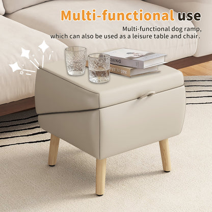 Beige upholstered ottoman with light wood legs, two crystal glasses and a stack of books on top on Tampa Home & Garden Store