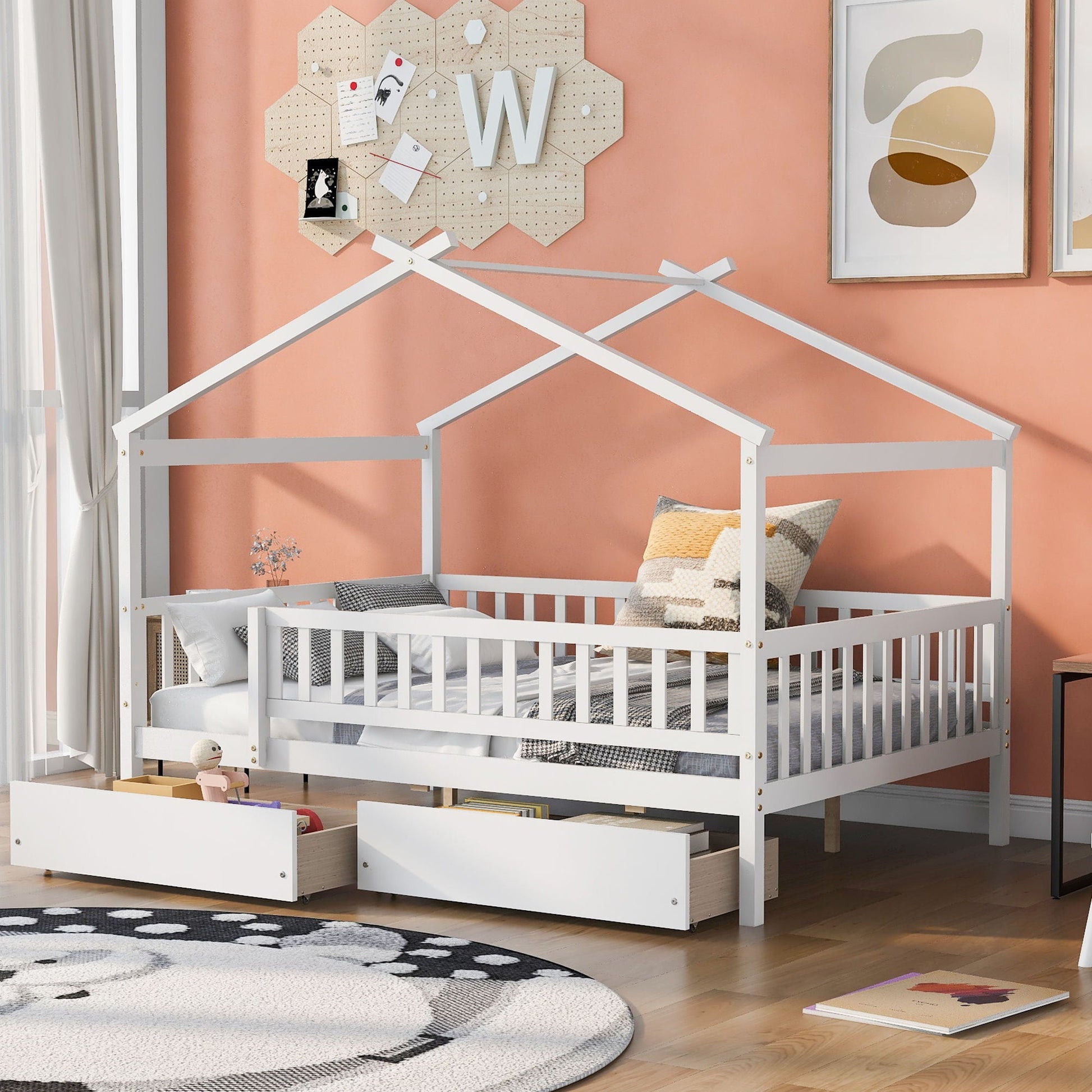 House bed with two under-bed drawers and sky roof storage in a peach nursery on Tampa Home & Garden Store