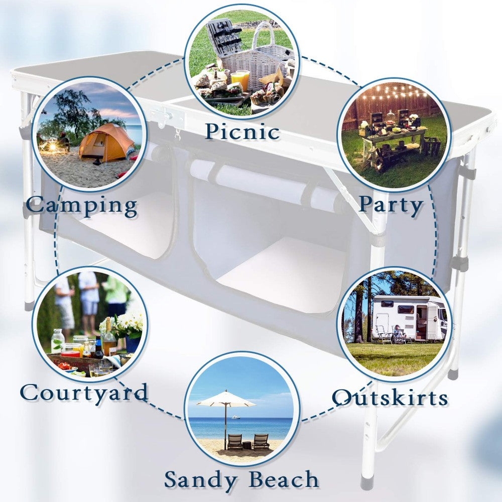 Folding camping table and storage compartment