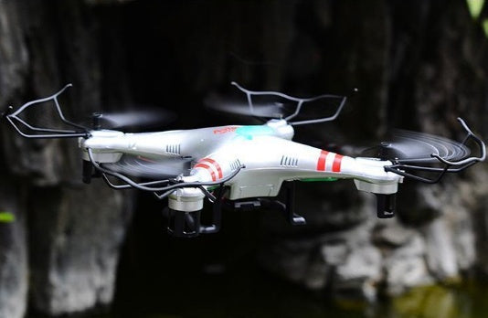 X52 Wide Angle HD Camera Drone quadcopter, white body with red accents in flight on Tampa Home & Garden Store