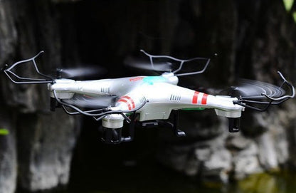 X52 Wide Angle HD Camera Drone quadcopter, white body with red accents in flight on Tampa Home & Garden Store