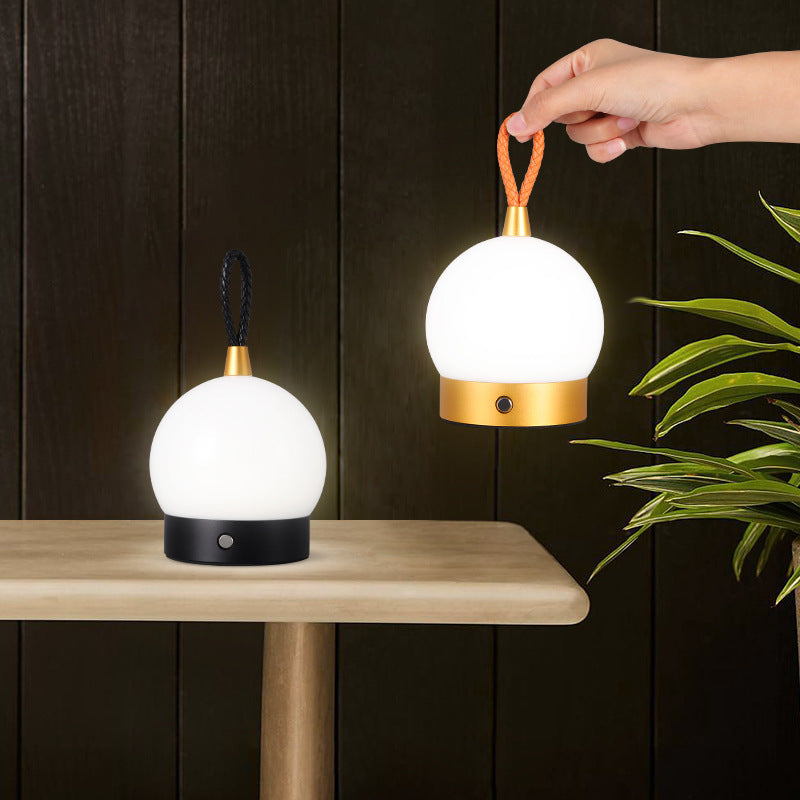 Night light globe wall fixtures two Sell My Stuff white sphere black brass bases orange cord on Tampa Home & Garden Store
