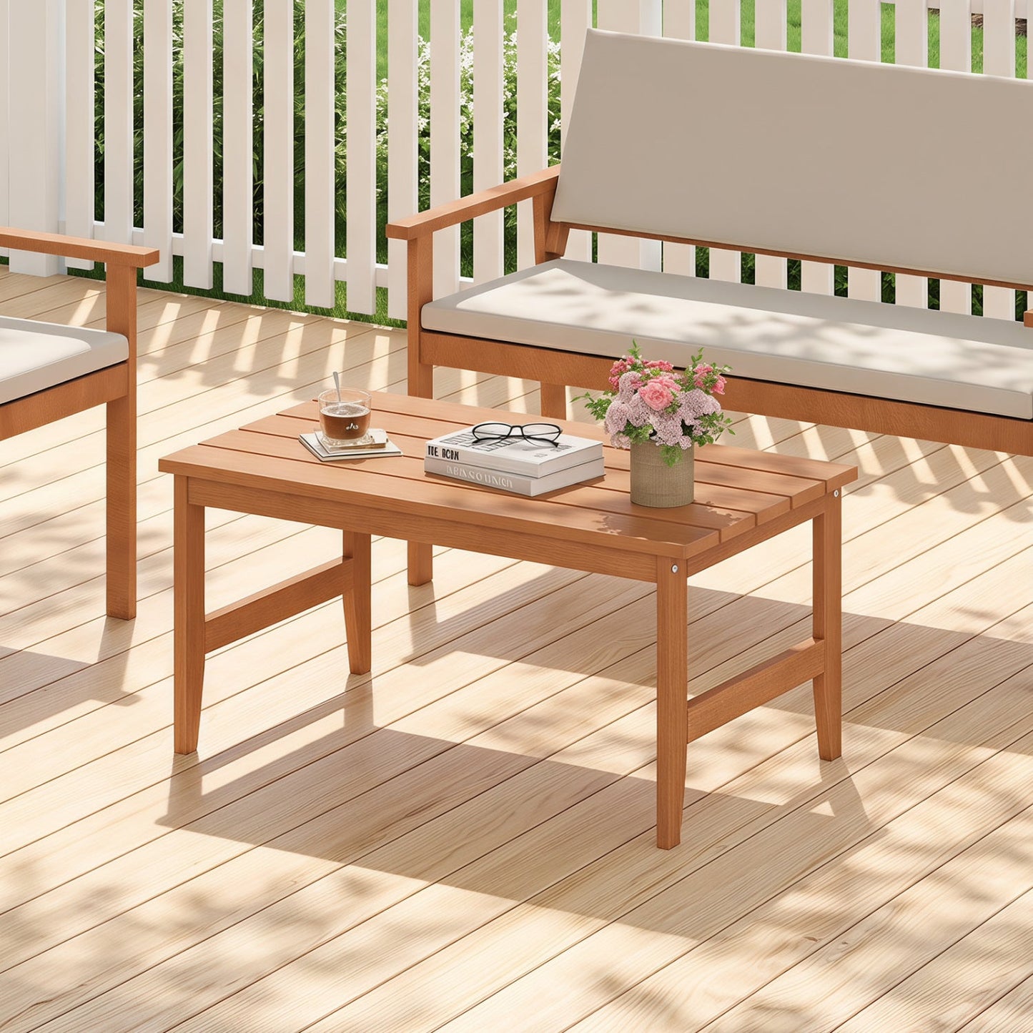 Rectangular teak outdoor coffee table by DirectDeals on a wooden patio deck with beige cushions on Tampa Home & Garden Store