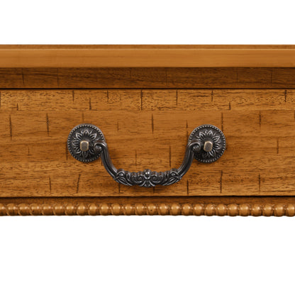 Rectangular wooden coffee table with storage drawer and ornate metal pulls, warm oak finish on Tampa Home & Garden Store
