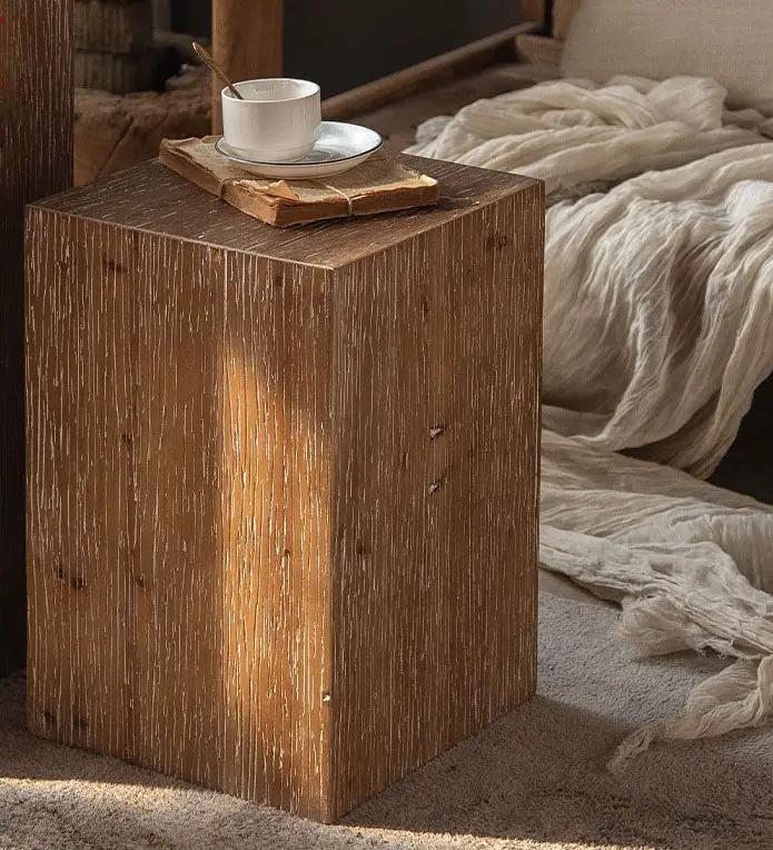 Retro solid wood square side table with weathered finish beside a bed with cup on top on Tampa Home & Garden Store