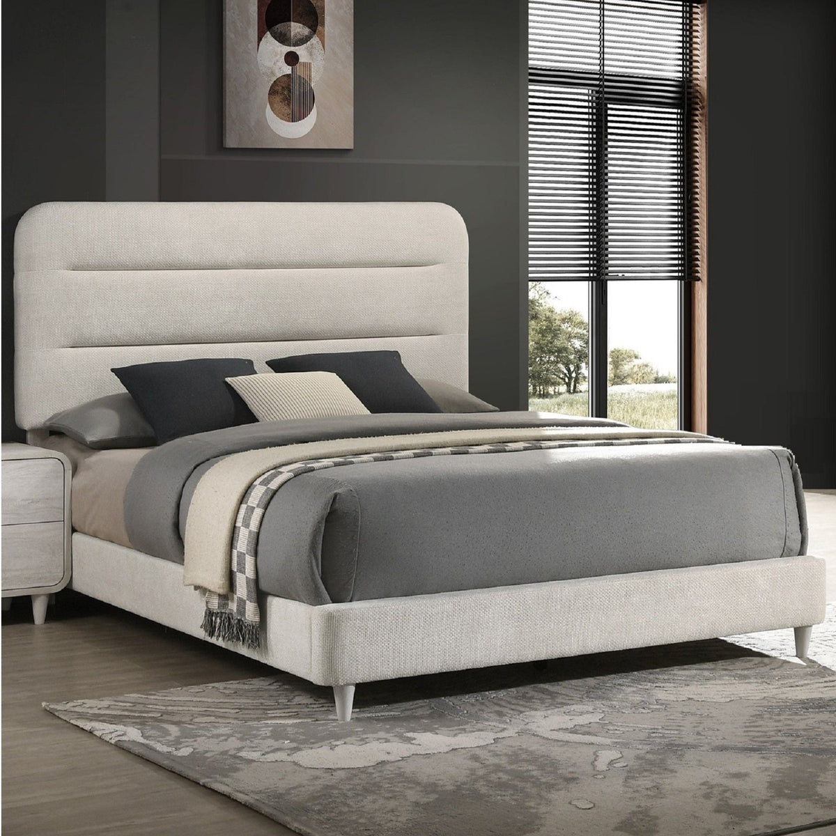 Upholstered panel bed by HouseOfZazla in light beige fabric with grey bedding on Tampa Home & Garden Store