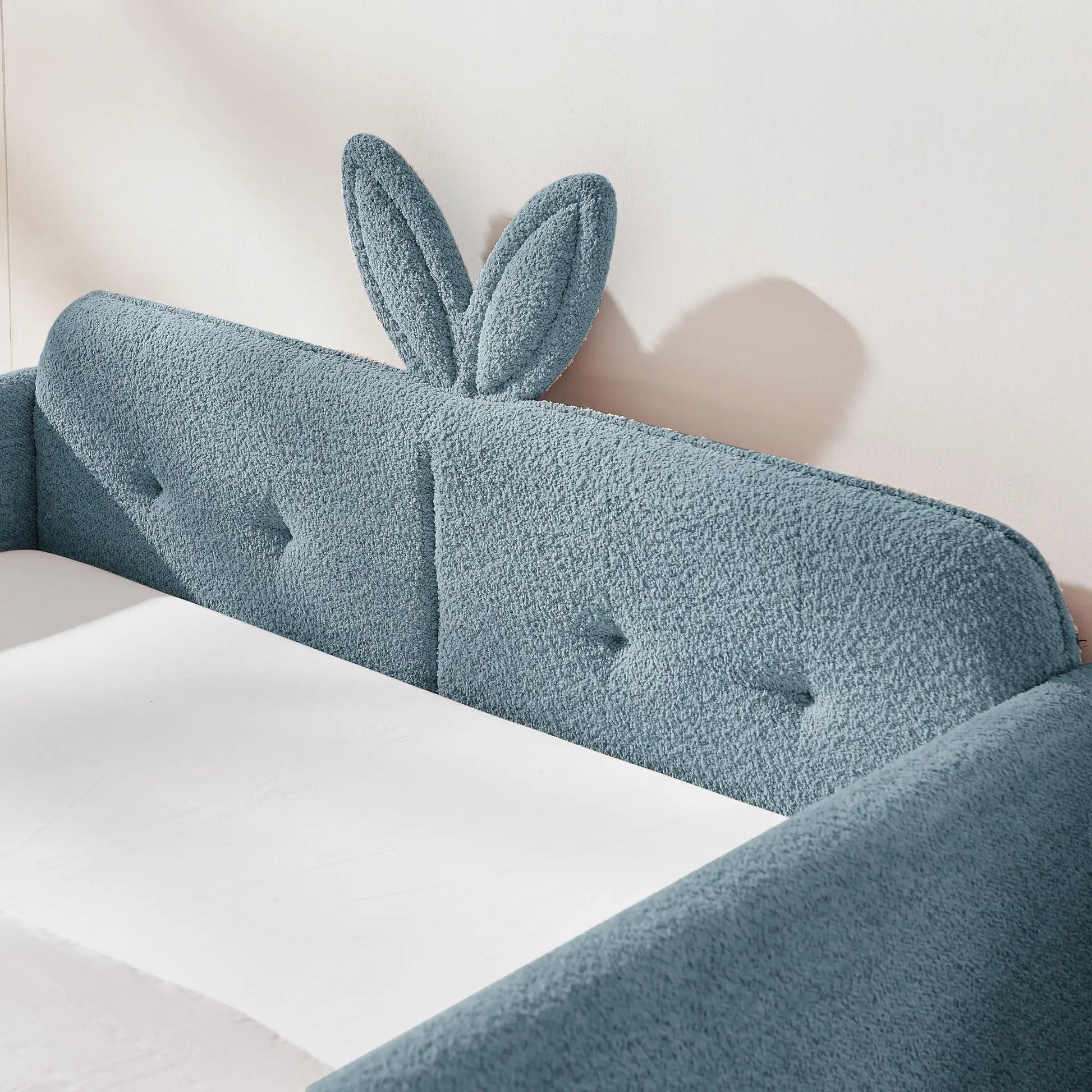 Cute rabbit-ear upholstered platform bed frame in blue boucle with safety rail on Tampa Home & Garden Store