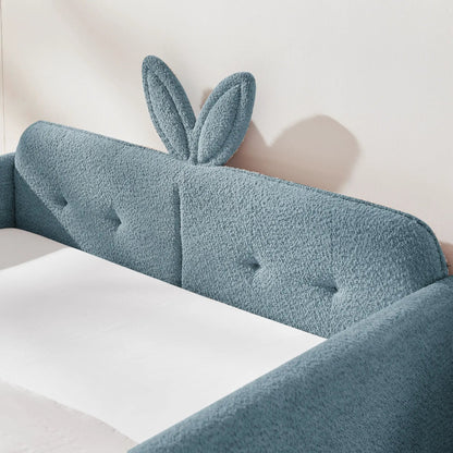Cute rabbit-ear upholstered platform bed frame in blue boucle with safety rail on Tampa Home & Garden Store