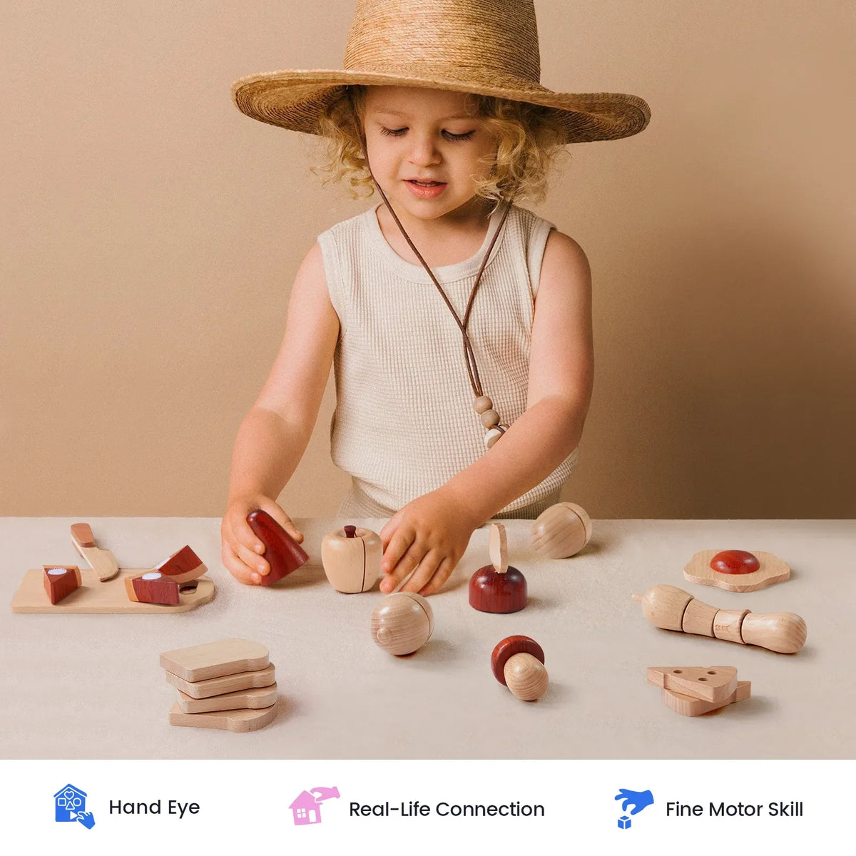 Tiny Land wooden play food set, natural wood with red accents, child playing with pieces on a table on Tampa Home & Garden Store