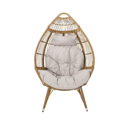 Teardrop wicker basket chair with water-resistant cream cushions, natural finish swing seat on Tampa Home & Garden Store