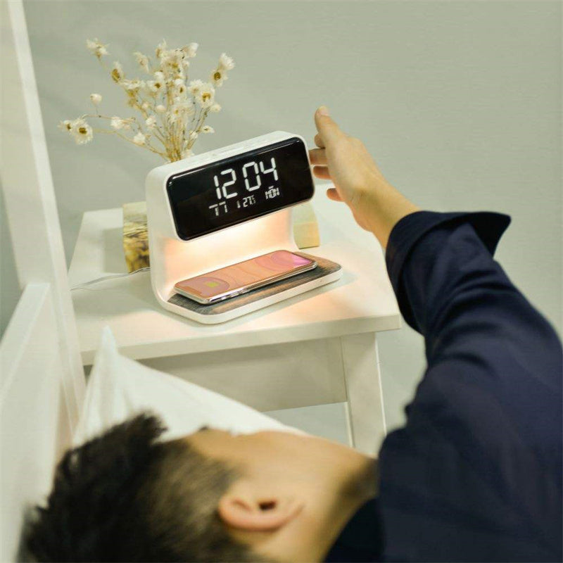 Perfecsy 3-in-1 bedside lamp with wireless charging and LCD clock; white design with phone on pad on Tampa Home & Garden Store
