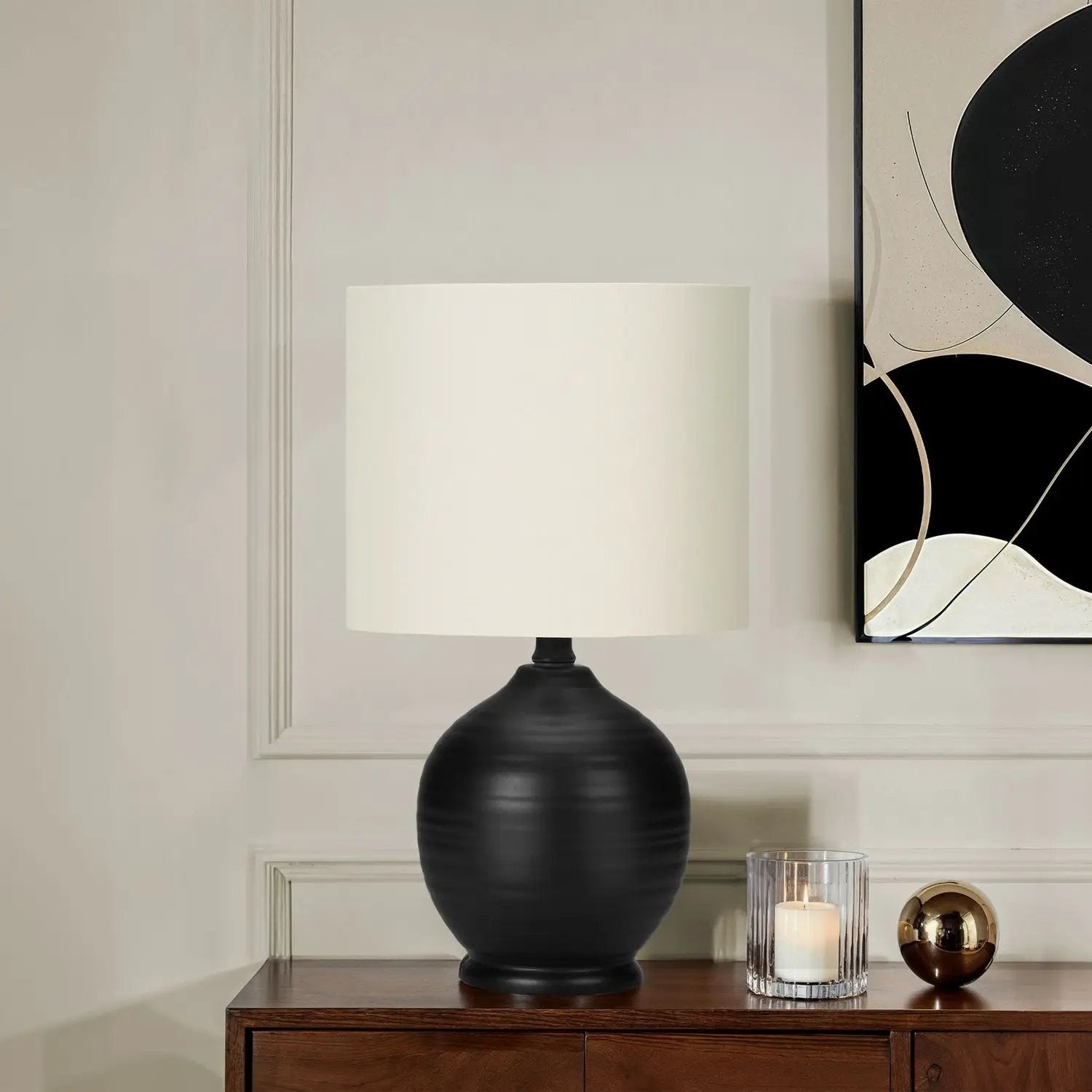 Table lamp ceramic black with white drum shade on dark wood console, transitional style on Tampa Home & Garden Store