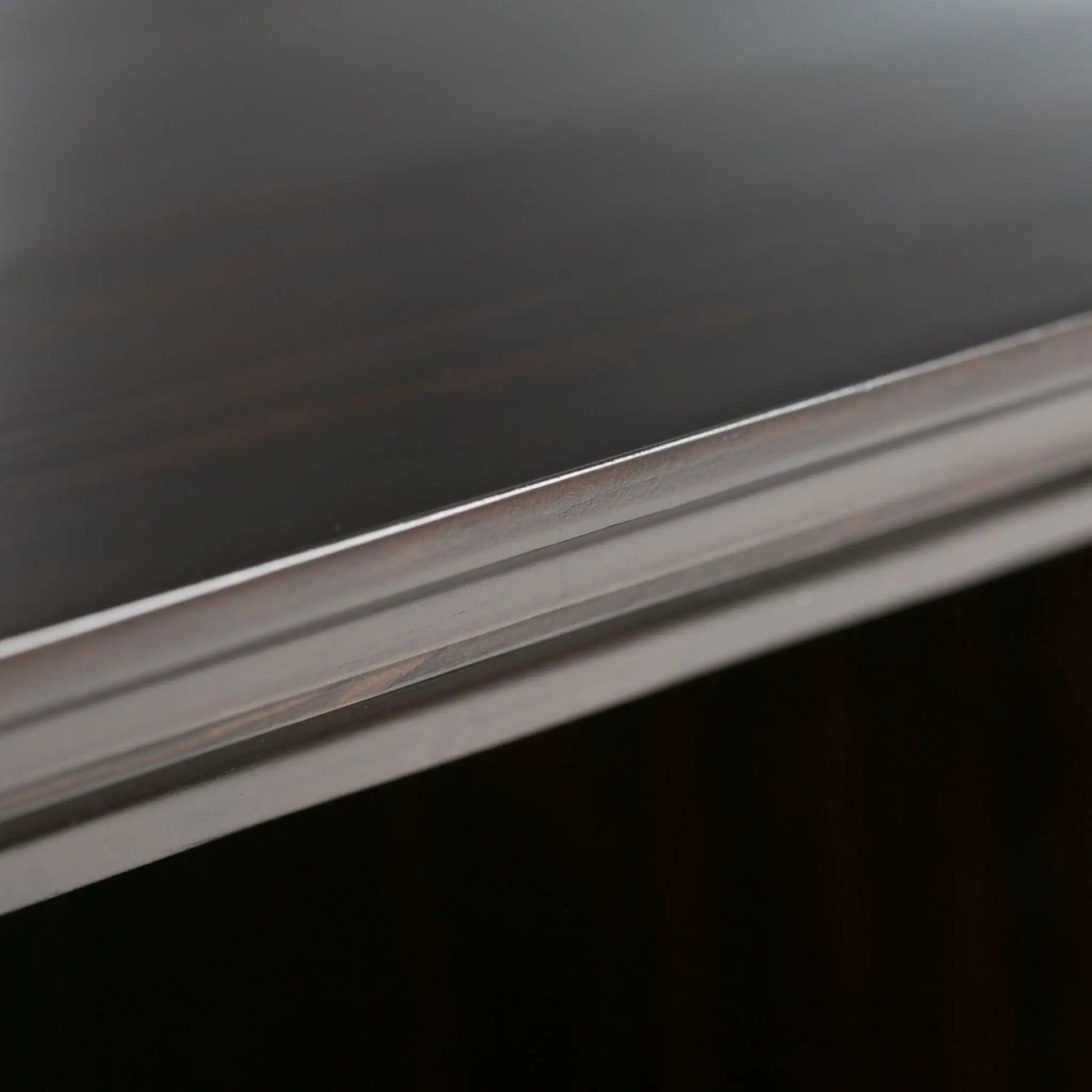 Amherst cube storage bookcase edge detail in dark finish with metal trim on Tampa Home & Garden Store
