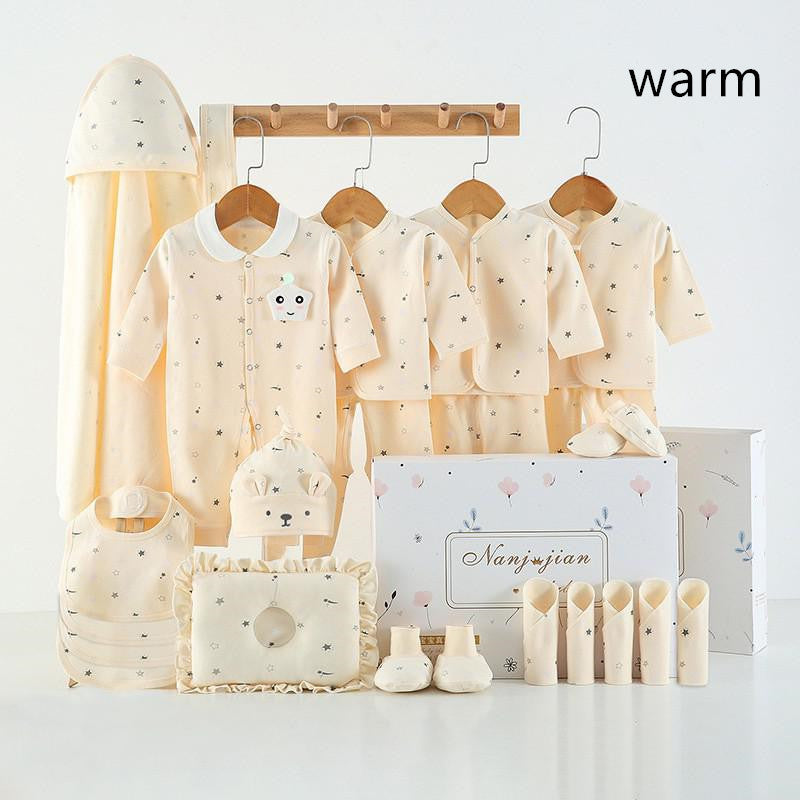 Newborn baby clothes gift set in warm cream with star print includes onesies, hat, booties on Tampa Home & Garden Store