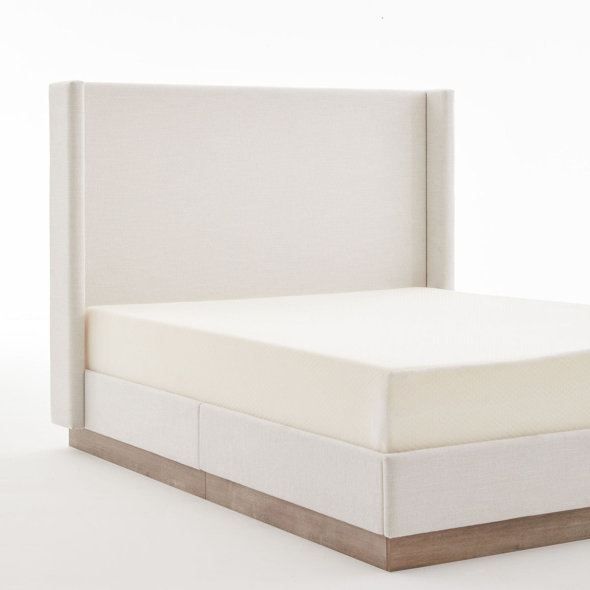 Hosford Minimalist Upholstered Wingback Bed in beige fabric with a natural wood base on Tampa Home & Garden Store