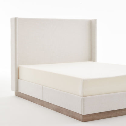 Hosford Minimalist Upholstered Wingback Bed in beige fabric with a natural wood base on Tampa Home & Garden Store