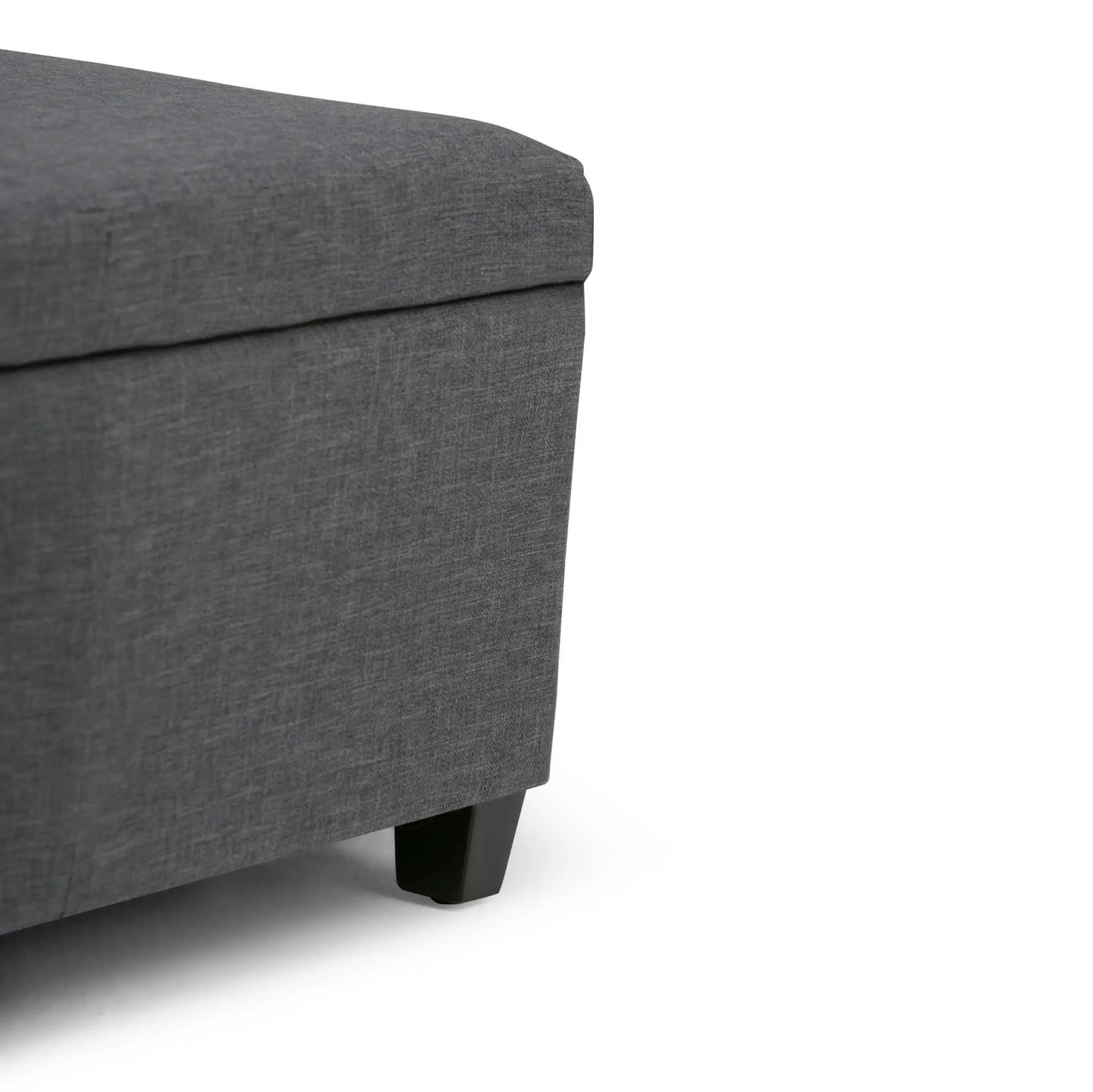 Avalon multifunctional storage ottoman bench in dark gray fabric with black wooden legs on Tampa Home & Garden Store