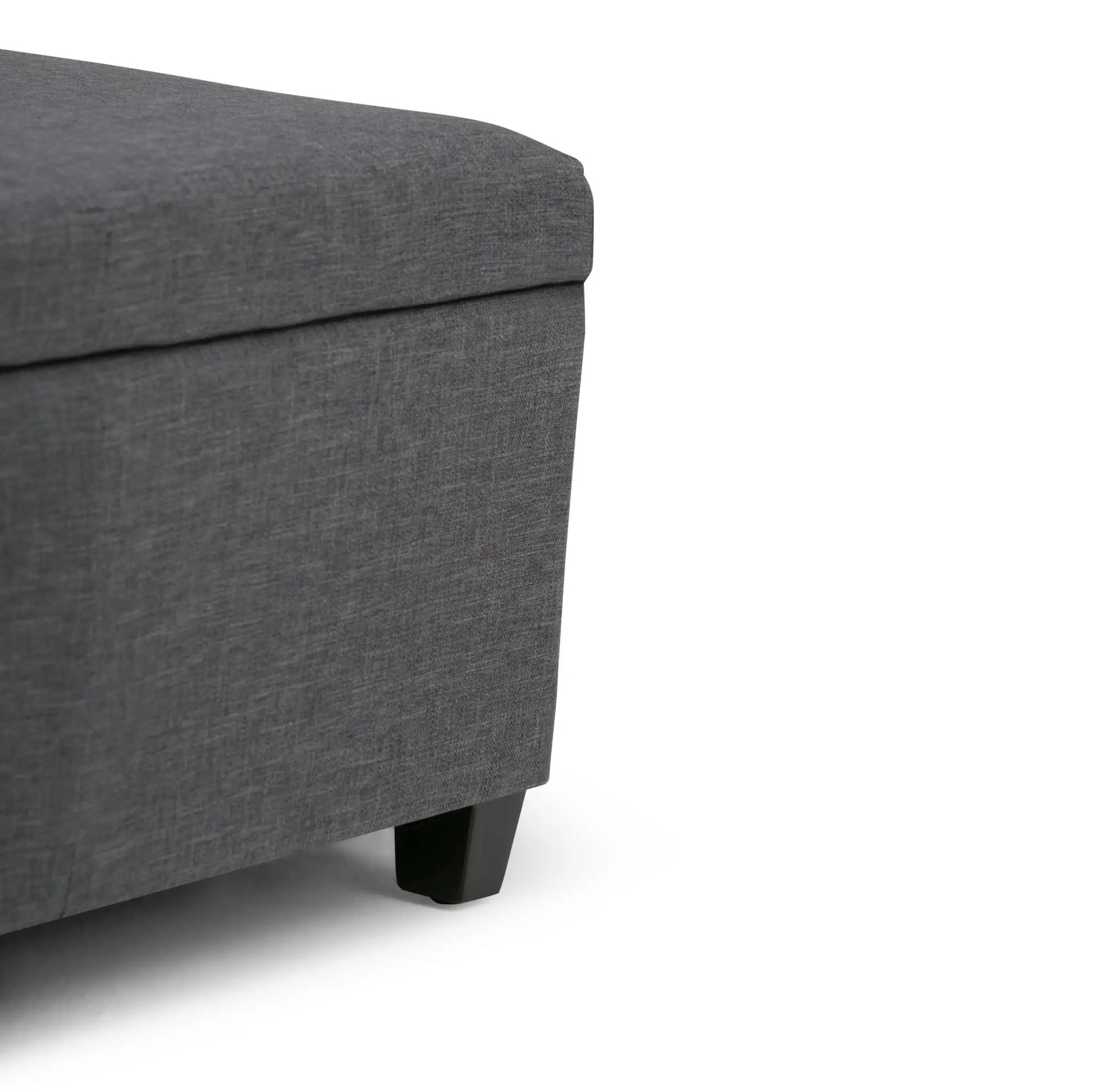 Avalon multifunctional storage ottoman bench in dark gray fabric with black wooden legs on Tampa Home & Garden Store