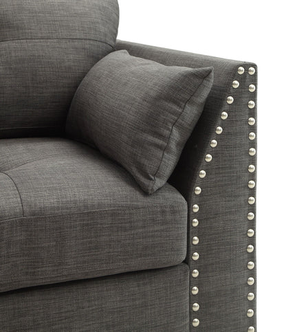 Laurissa armchair with three pillows in light charcoal fabric and metal studded arms on Tampa Home & Garden Store