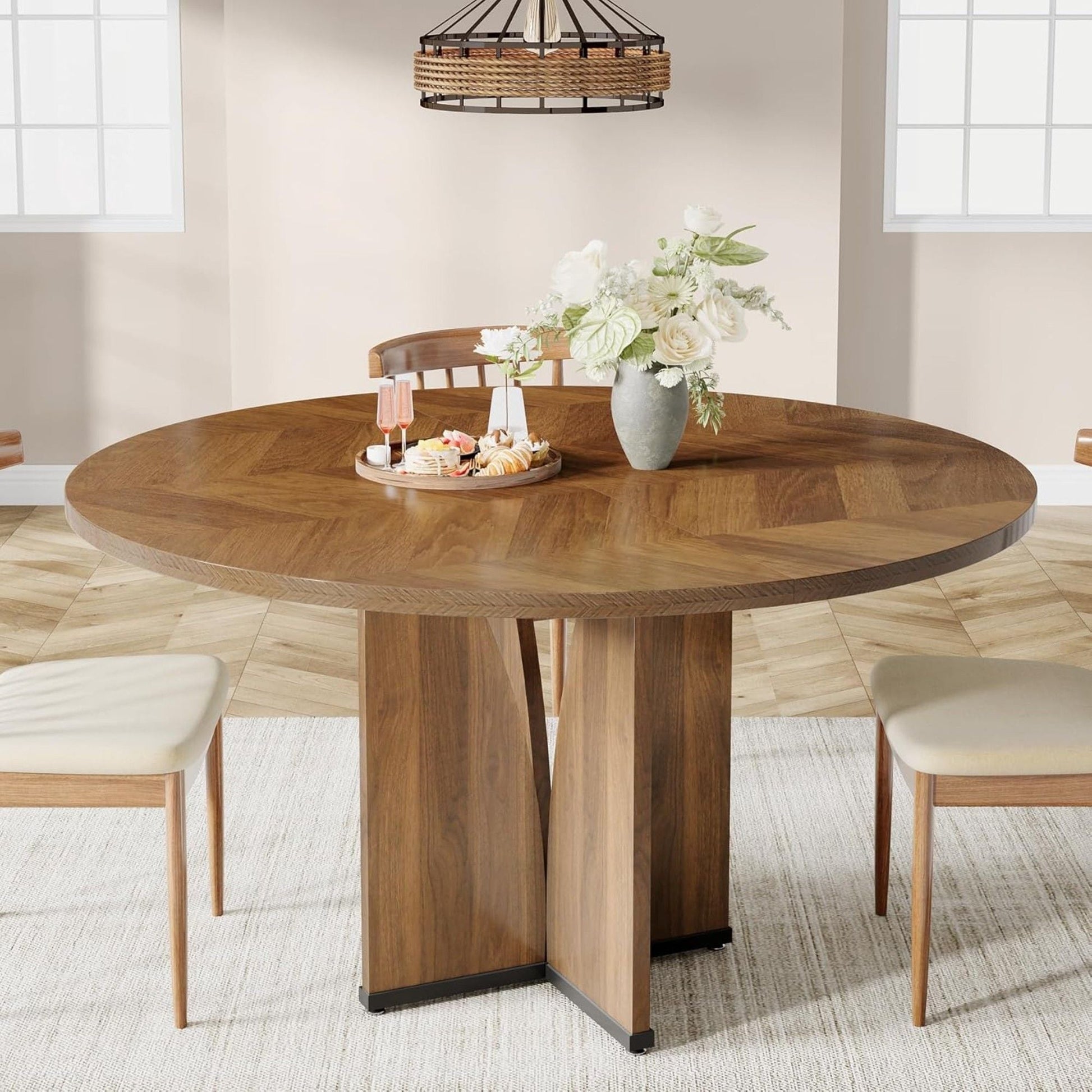 Round compact dining table for 4 in rustic brown with a pedestal base and beige chairs on Tampa Home & Garden Store