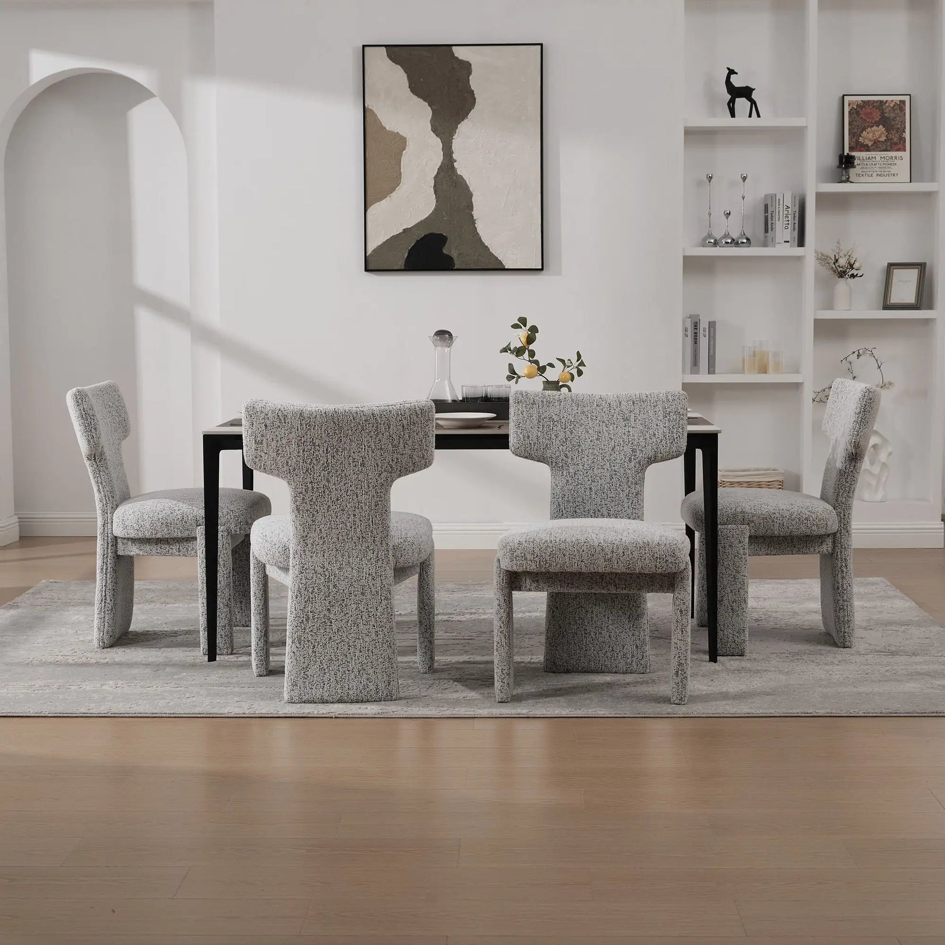 Unique Piece Furniture armless curved-back accent chairs in gray fabric around dining table on Tampa Home & Garden Store