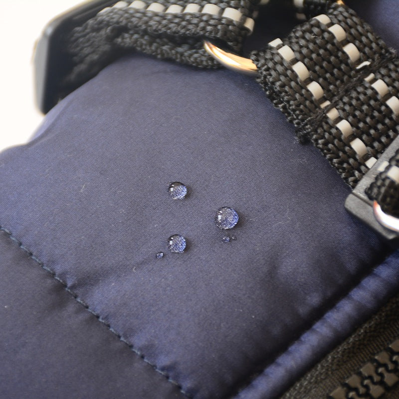 Pet Zen navy small-dog hooded coat with braided harness strap and water droplets on fabric on Tampa Home & Garden Store