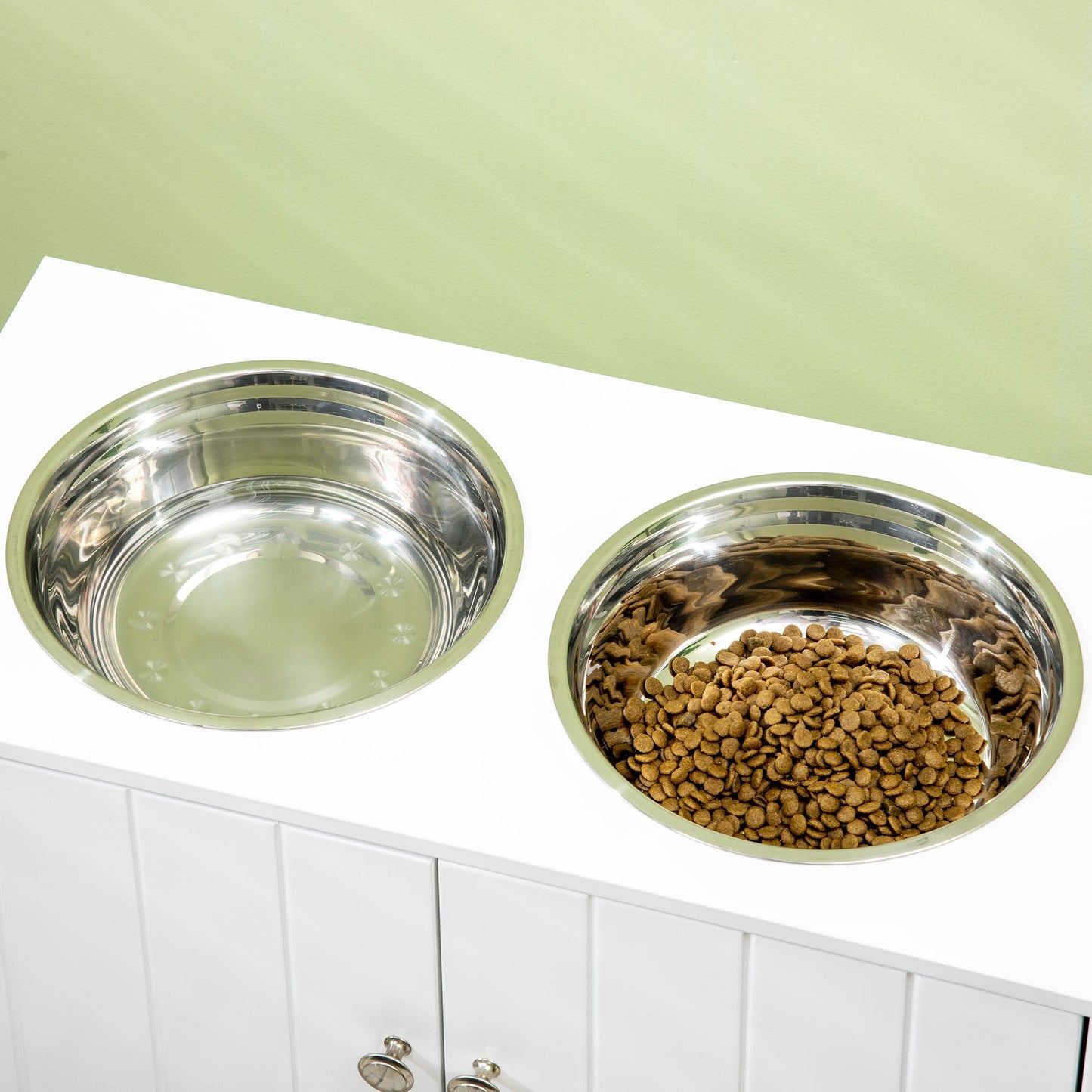 PawHut raised dog bowls with storage cabinet; stainless steel bowls on white counter on Tampa Home & Garden Store