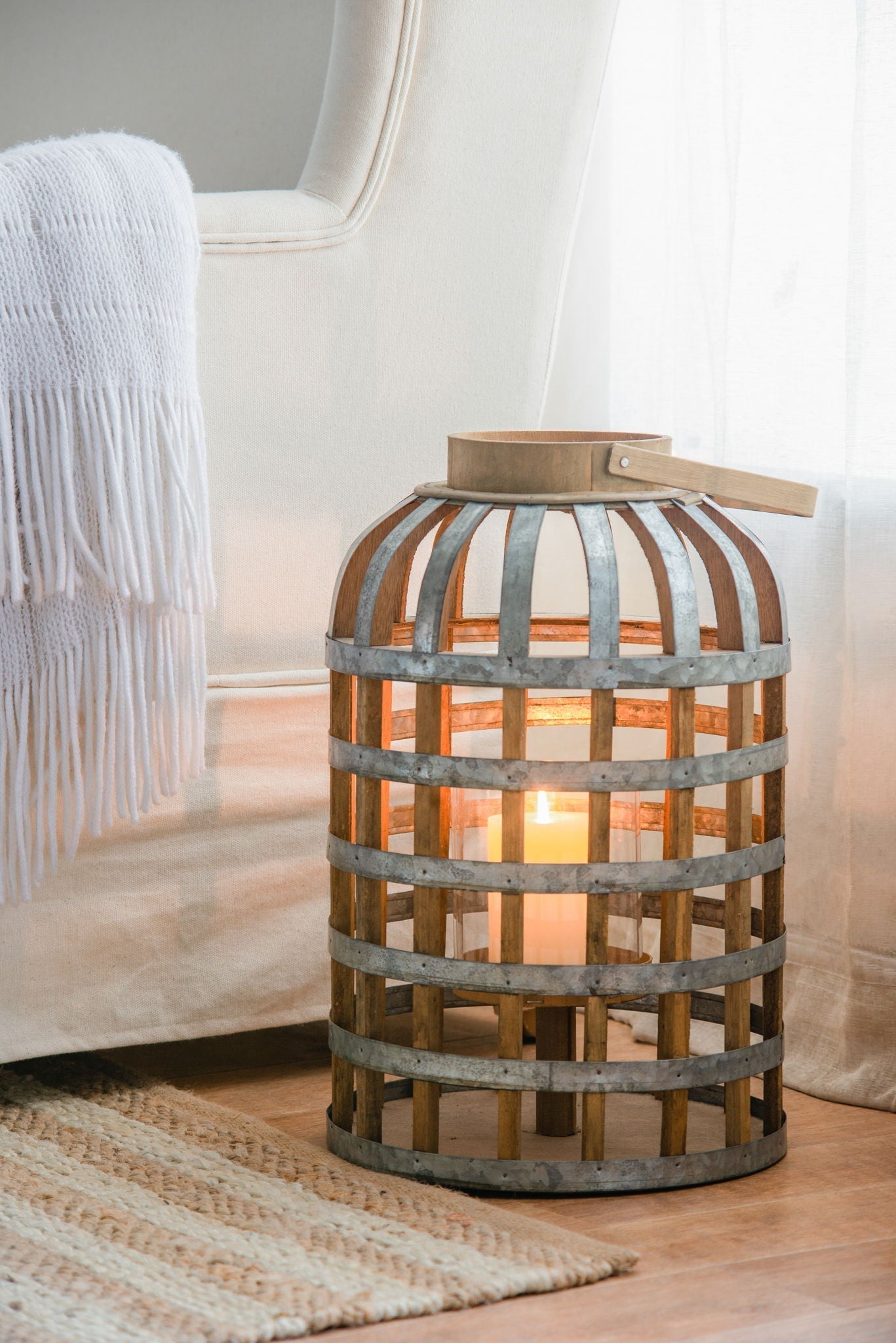 Decorative wooden lantern with metal bands and a top handle; candlelit interior by HouseOfZazla on Tampa Home & Garden Store