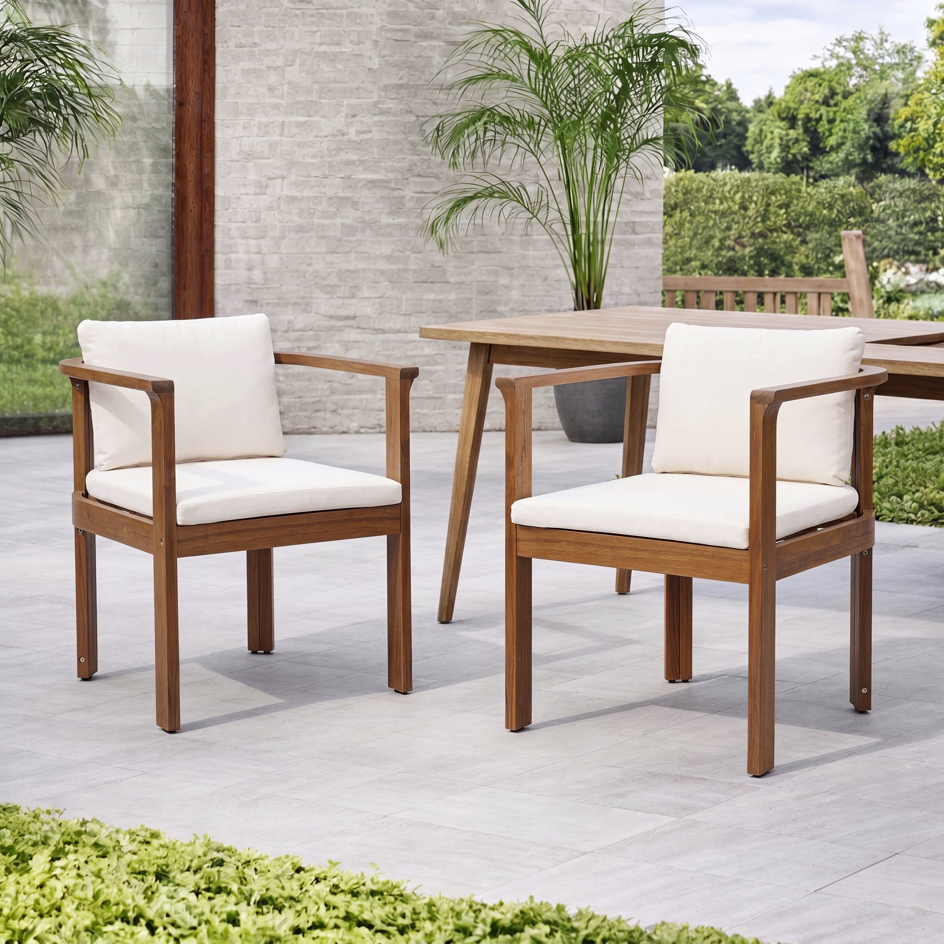 Outdoor dining chair set of 2 with curved acacia wood arms and white cushions on Tampa Home & Garden Store