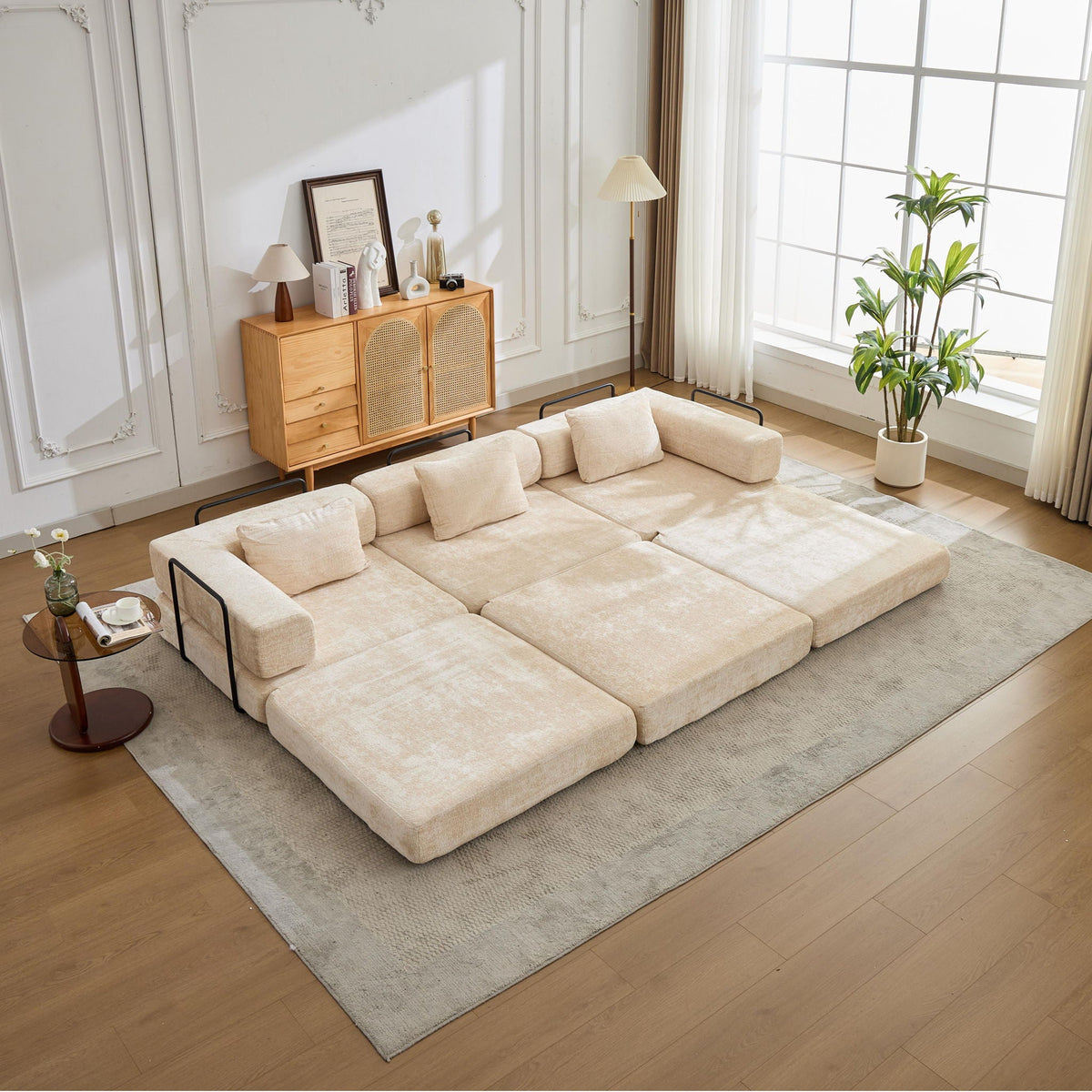 Beige boneless modular floor futon sofa bed with plush cushions in a bright living room on Tampa Home & Garden Store