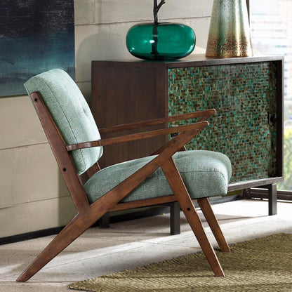Lounge chair with tufted green upholstery and solid wood frame on Tampa Home & Garden Store