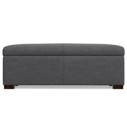 Gabbie storage ottoman upholstered in dark gray fabric with wooden legs on Tampa Home & Garden Store