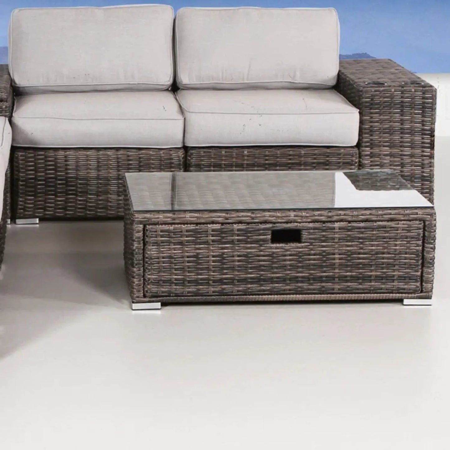 Modern patio rattan sectional with beige cushions and glass coffee table, brown wicker set on Tampa Home & Garden Store
