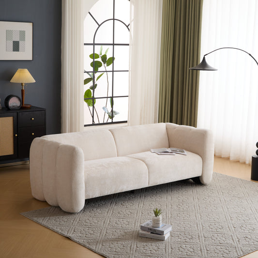 Tonson 83in 3-Seater Boucle Sofa in beige boucle fabric sits in a modern living room with neutral curtains on Tampa Home & Garden Store