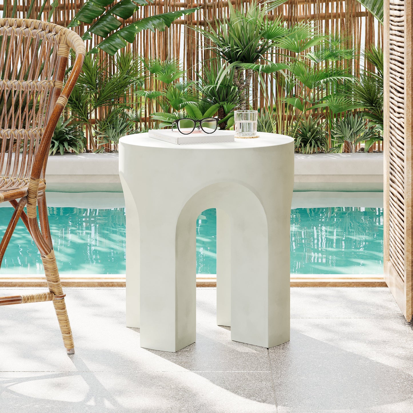 Outdoor MGO Round Top Side Table in Antique White with sunglasses, book, glass on Tampa Home & Garden Store
