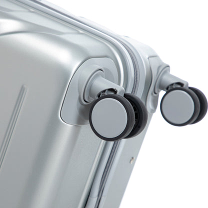 ABS spinner wheel close-up on silver hard-shell luggage on Tampa Home & Garden Store