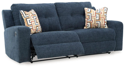 Danum 2-seat reclining sofa in blue textured fabric with tufted cushions on Tampa Home & Garden Store