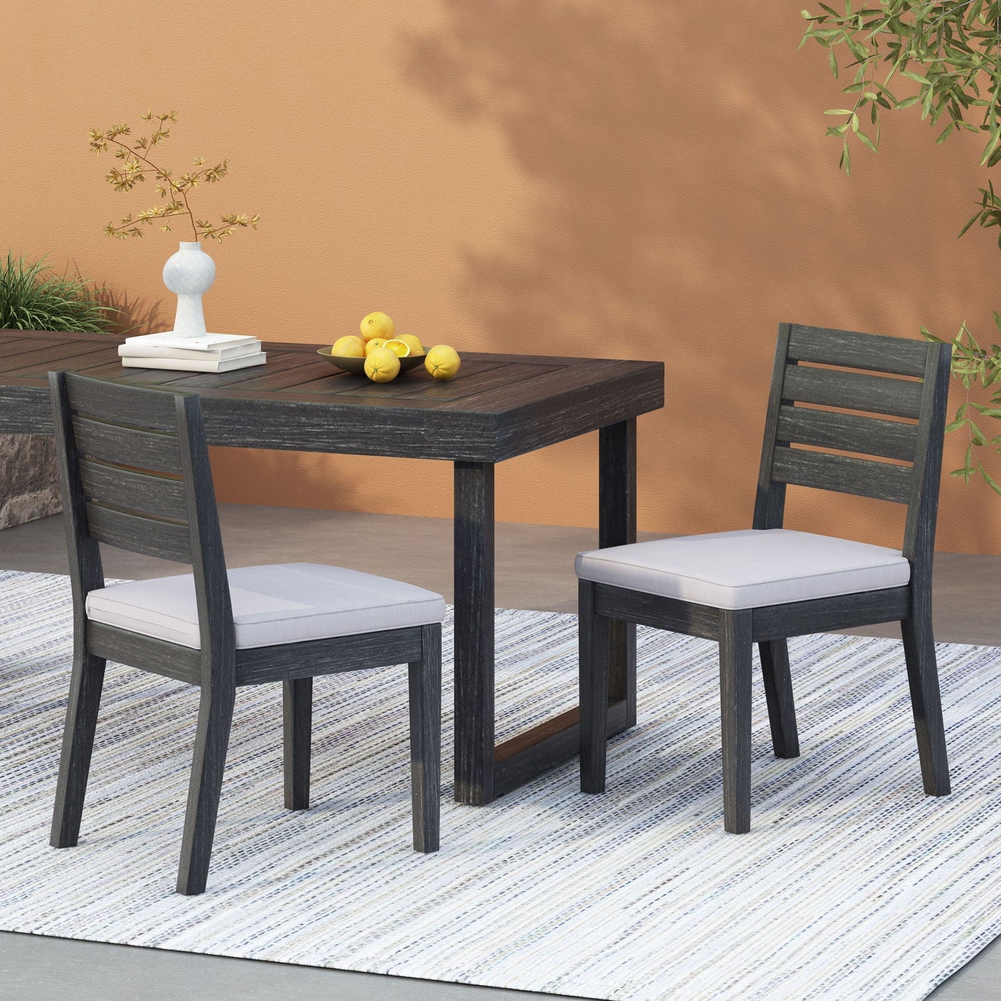 Outdoor Armless Dining Chair With Cushions, dark wood frame and gray cushions on Tampa Home & Garden Store
