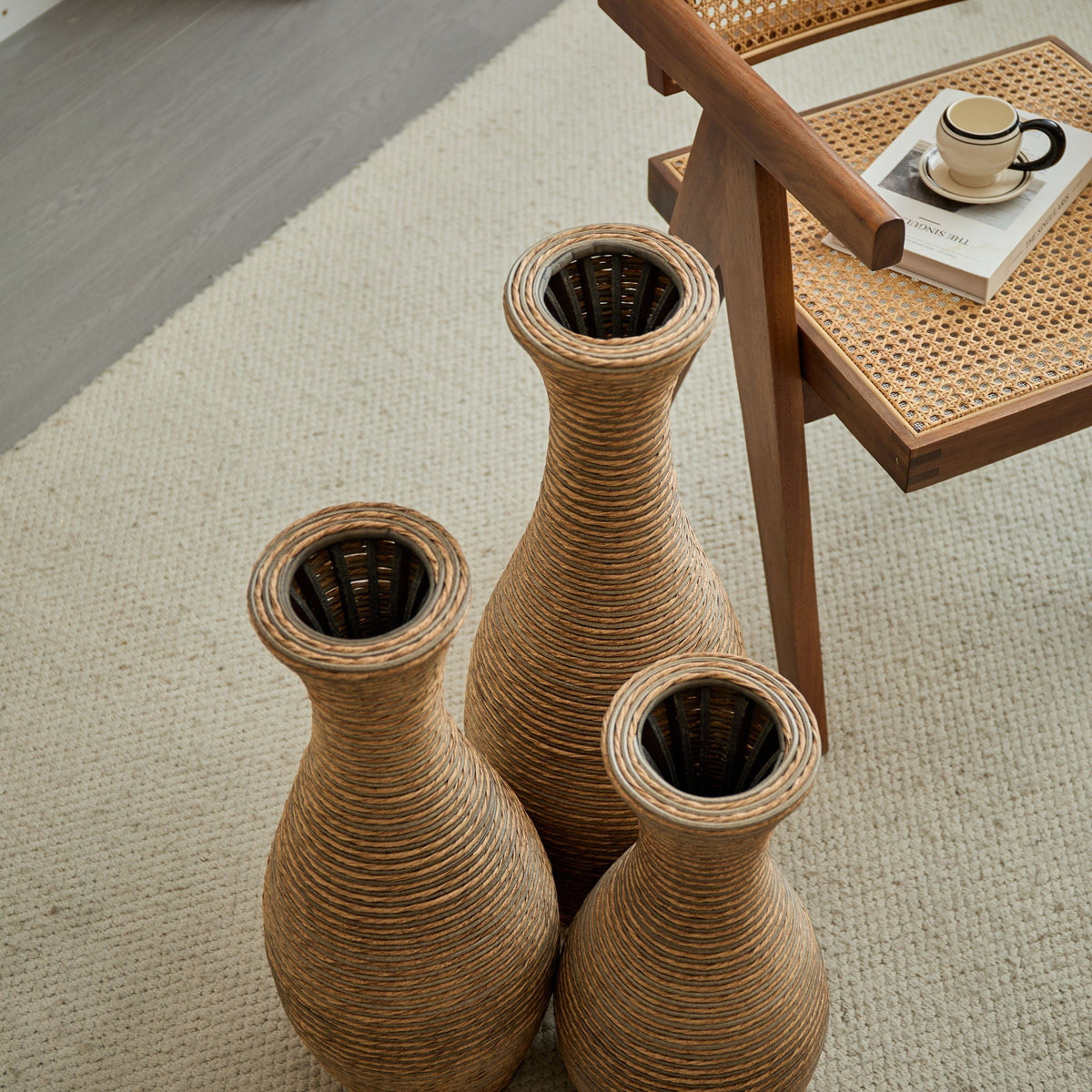3-piece beige artificial rattan floor vase set in varying heights on a woven caned table on Tampa Home & Garden Store