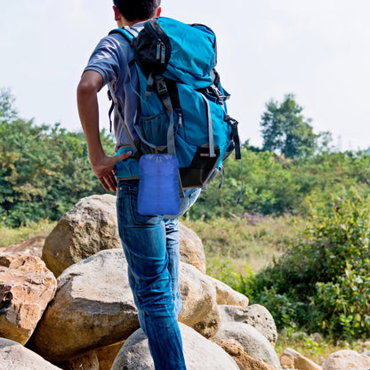 Blue GemGear hiking backpack with straps and side pocket on rocky trail on Tampa Home & Garden Store