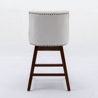 Counter height swivel barstool in beige fabric with brass nailhead trim and dark wood legs on Tampa Home & Garden Store