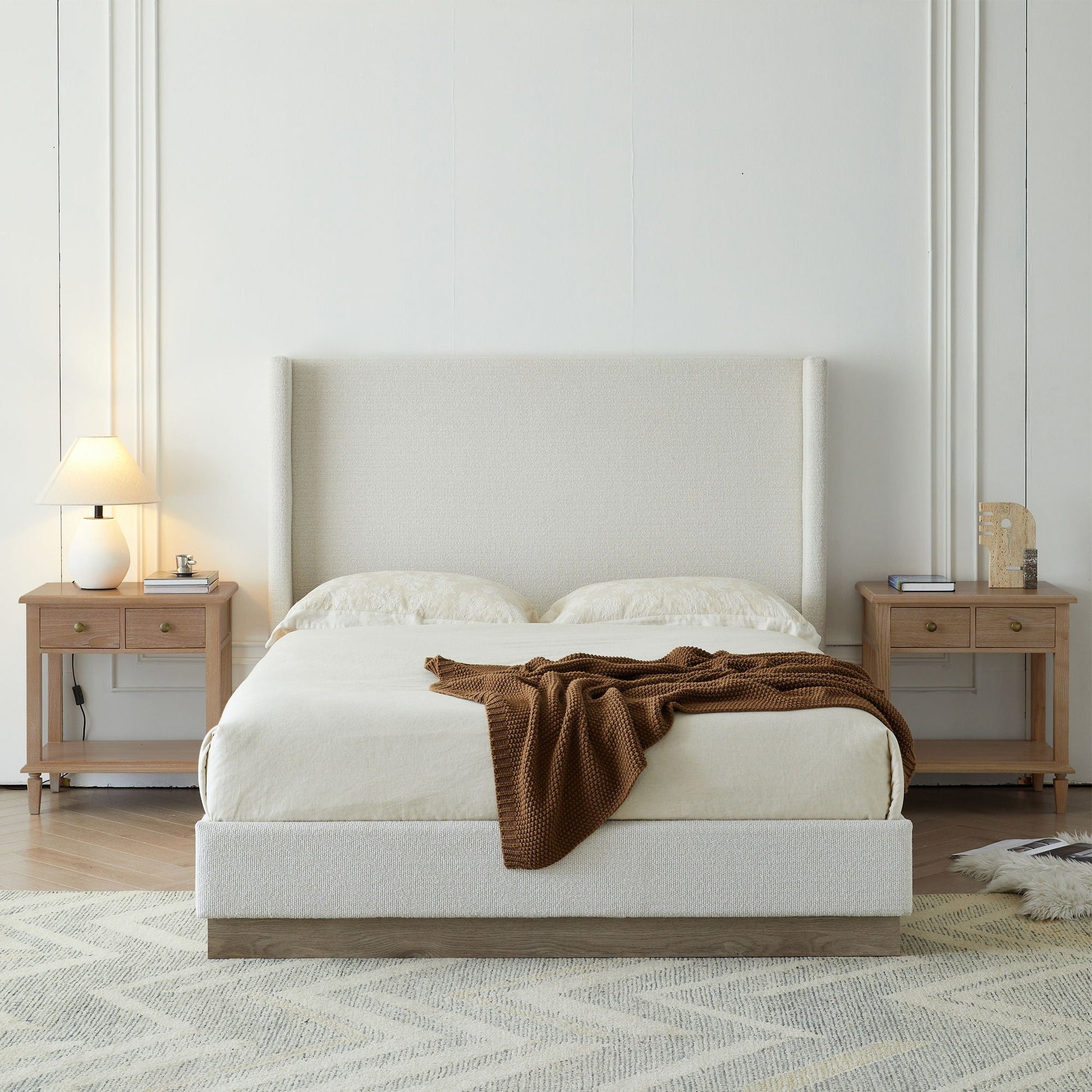 Hale upholstered wingback bed in beige fabric with wood base, flanked by nightstands on Tampa Home & Garden Store
