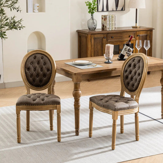 Set of four tufted dining chairs with brown upholstery and wood frames, nailhead trim on Tampa Home & Garden Store
